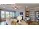 Cozy living room with hardwood floors, a fireplace, built-in shelving, and plenty of natural light at 122 N Shayna Rd, Troutman, NC 28166
