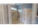 Modern shower with glass door, bench, tile surround, and decorative tile accent at 122 N Shayna Rd, Troutman, NC 28166