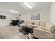 Finished basement featuring a comfortable seating area, a wet bar, and a dart board for entertainment at 123 Scotch Irish Ln # 136, Troutman, NC 28166