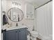 Modern bathroom with oval mirror, new vanity, brushed nickel fixtures, and updated lighting at 123 Scotch Irish Ln # 136, Troutman, NC 28166