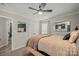 A comfortable bedroom with neutral-toned walls, a large window, and a ceiling fan for added comfort at 123 Scotch Irish Ln # 136, Troutman, NC 28166