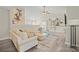 Open-concept living room featuring vaulted ceilings, modern furnishings, and stylish decor at 123 Scotch Irish Ln # 136, Troutman, NC 28166