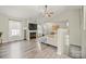 Spacious living room with fireplace, large windows, and hardwood floors at 123 Scotch Irish Ln # 136, Troutman, NC 28166