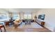 Bright and airy living room with hardwood floors, neutral furniture, large windows, and a view of the outdoors at 12572 Forager Pl # 68, Midland, NC 28107