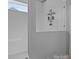 All-white bathroom with a modern shower featuring subway tile surround and sleek glass enclosure at 12709 Messenger Row, Huntersville, NC 28078