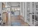 Inviting foyer featuring hardwood floors, stylish decor, and French doors leading to a living area with abundant natural light at 12709 Messenger Row, Huntersville, NC 28078