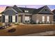 Charming single-Gathering home featuring stone accents, manicured landscaping, and a welcoming front entrance with dark shutters at 12709 Messenger Row, Huntersville, NC 28078