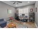 This home office boasts a large window, modern desk, and stylish decor, ideal for remote work at 12709 Messenger Row, Huntersville, NC 28078