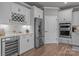 Modern kitchen with stainless steel appliances, wine fridge, and custom cabinetry for storage at 12709 Messenger Row, Huntersville, NC 28078