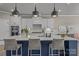 Gorgeous kitchen with island, pendant lighting, stainless appliances, and ample counter space at 12709 Messenger Row, Huntersville, NC 28078