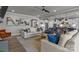 Inviting living room showcasing a neutral palette, stylish furnishings, and seamless flow to kitchen at 12709 Messenger Row, Huntersville, NC 28078