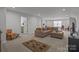 Expansive living room with comfortable seating area and neutral decor at 12709 Messenger Row, Huntersville, NC 28078