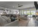 Open-concept living room with sliding doors to patio, creating a bright and airy space at 12709 Messenger Row, Huntersville, NC 28078