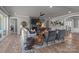 Spacious living room with stone fireplace and comfortable seating, perfect for entertaining guests at 12709 Messenger Row, Huntersville, NC 28078