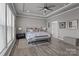 Large main bedroom with tray ceiling, neutral colors, ample natural light, and wood-look floors at 12709 Messenger Row, Huntersville, NC 28078