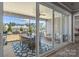 Inviting covered patio with outdoor seating and picturesque backyard view at 12709 Messenger Row, Huntersville, NC 28078