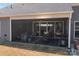 Cozy screened-in patio features comfortable seating, an outdoor dining table, and barbecue, perfect for relaxation at 12709 Messenger Row, Huntersville, NC 28078
