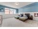 Shared bedroom with two beds, wainscoting, and large windows for natural light at 1274 Fishing Creek Rd # 134, Clover, SC 29710
