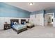 Shared bedroom with two beds, paneled wainscoting, and adjoining doors at 1274 Fishing Creek Rd # 134, Clover, SC 29710