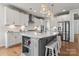 Kitchen with a center island, white cabinetry, stainless appliances, and counter seating at 1274 Fishing Creek Rd # 134, Clover, SC 29710