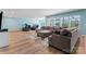 Large living room featuring modern furnishings, hardwood floors, and an abundance of windows at 1274 Fishing Creek Rd # 134, Clover, SC 29710