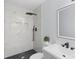 Stylish bathroom featuring a walk-in shower with white marbled tile and modern black fixtures at 1315 Vickie Ln, Matthews, NC 28104