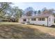 Well-maintained single-story home with white brick, charming shutters, and a green lawn at 1315 Vickie Ln, Matthews, NC 28104