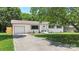Inviting home with painted brick, new garage and shutters on a meticulously maintained lot and yard at 1315 Vickie Ln, Matthews, NC 28104
