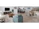 Open-concept living room with hardwood floors, modern furnishings, and an adjacent kitchen and dining area at 1315 Vickie Ln, Matthews, NC 28104