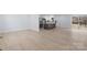 Open-concept living space with hardwood floors and a view of a modern kitchen at 1315 Vickie Ln, Matthews, NC 28104