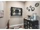 Stylish bar area featuring custom wine rack and cabinet with unique circular accents at 135 Frostcliff Ln, Mooresville, NC 28117