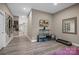 Finished basement with exercise equipment and ample wall decor at 135 Frostcliff Ln, Mooresville, NC 28117