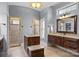 Bathroom featuring a walk-in shower, granite counters, and updated fixtures at 135 Frostcliff Ln, Mooresville, NC 28117