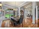 Elegant dining room showcasing large windows and hardwood floors at 135 Frostcliff Ln, Mooresville, NC 28117
