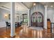 Grand foyer featuring a double-door entryway and hardwood floors at 135 Frostcliff Ln, Mooresville, NC 28117