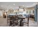 Open-concept kitchen and dining area with stainless steel appliances and modern finishes at 135 Frostcliff Ln, Mooresville, NC 28117