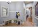 Mudroom featuring built-in bench seating with a granite countertop and storage at 135 Frostcliff Ln, Mooresville, NC 28117
