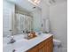 Bathroom featuring double sinks, a large mirror, and walk-in shower at 15327 Rush Lake Ln, Huntersville, NC 28078