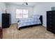 Bright bedroom features neutral carpet, two dressers, and a window at 15327 Rush Lake Ln, Huntersville, NC 28078