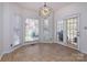 A sunny breakfast nook is surrounded by windows, providing natural light and views to the outside at 15327 Rush Lake Ln, Huntersville, NC 28078