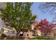 Home exterior with stone wall and manicured lawn at 15327 Rush Lake Ln, Huntersville, NC 28078