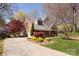 Well-maintained home featuring a concrete driveway, lush lawn, and vibrant landscaping in a tranquil setting at 15327 Rush Lake Ln, Huntersville, NC 28078