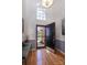 Elegant foyer with hardwood floors, high ceilings, transom windows, and stylish decor at 15327 Rush Lake Ln, Huntersville, NC 28078