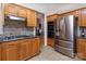 A well-equipped kitchen features stainless steel appliances, granite countertops, and tile backsplash at 15327 Rush Lake Ln, Huntersville, NC 28078