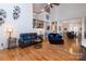 Open-concept living area with high ceilings, hardwood floors, and ample space for entertaining at 15327 Rush Lake Ln, Huntersville, NC 28078