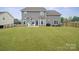 Spacious backyard featuring a well-maintained lawn and a private patio area, great for outdoor living at 19412 Bird Meadow Dr, Huntersville, NC 28078
