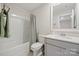 This bathroom features a white vanity and a shower with tub at 19412 Bird Meadow Dr, Huntersville, NC 28078