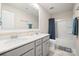 This bathroom features a double sink vanity, shower, tub, and blue accents at 19412 Bird Meadow Dr, Huntersville, NC 28078