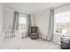 Bright bedroom with neutral paint, an accent chair, and plenty of natural light at 19412 Bird Meadow Dr, Huntersville, NC 28078
