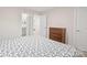 This bedroom features a dresser and access to the bathroom through an open door at 19412 Bird Meadow Dr, Huntersville, NC 28078